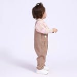 أفرول مُزين بجيوب وورد للمواليد البنات