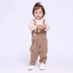 أفرول مُزين بجيوب وورد للمواليد البنات