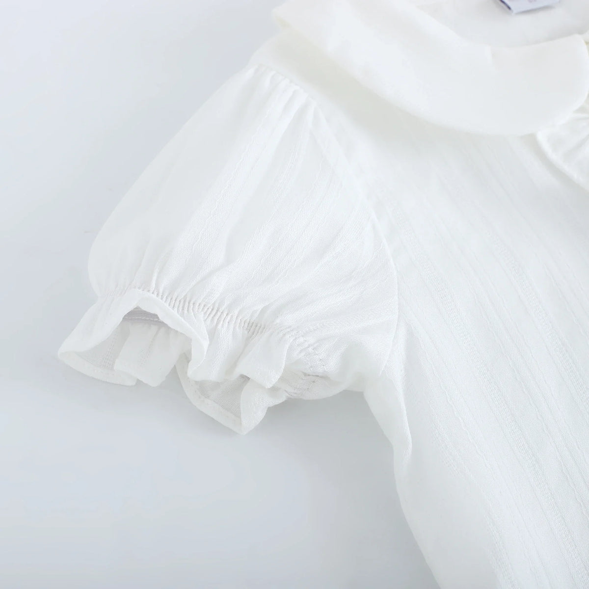 بلوزة بأكمام منفوخ بنقشة الجاكار للبنات المواليد