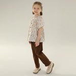 بلوزة بأكمام واسعة مزينة بنقوش زهور عصرية للبنات